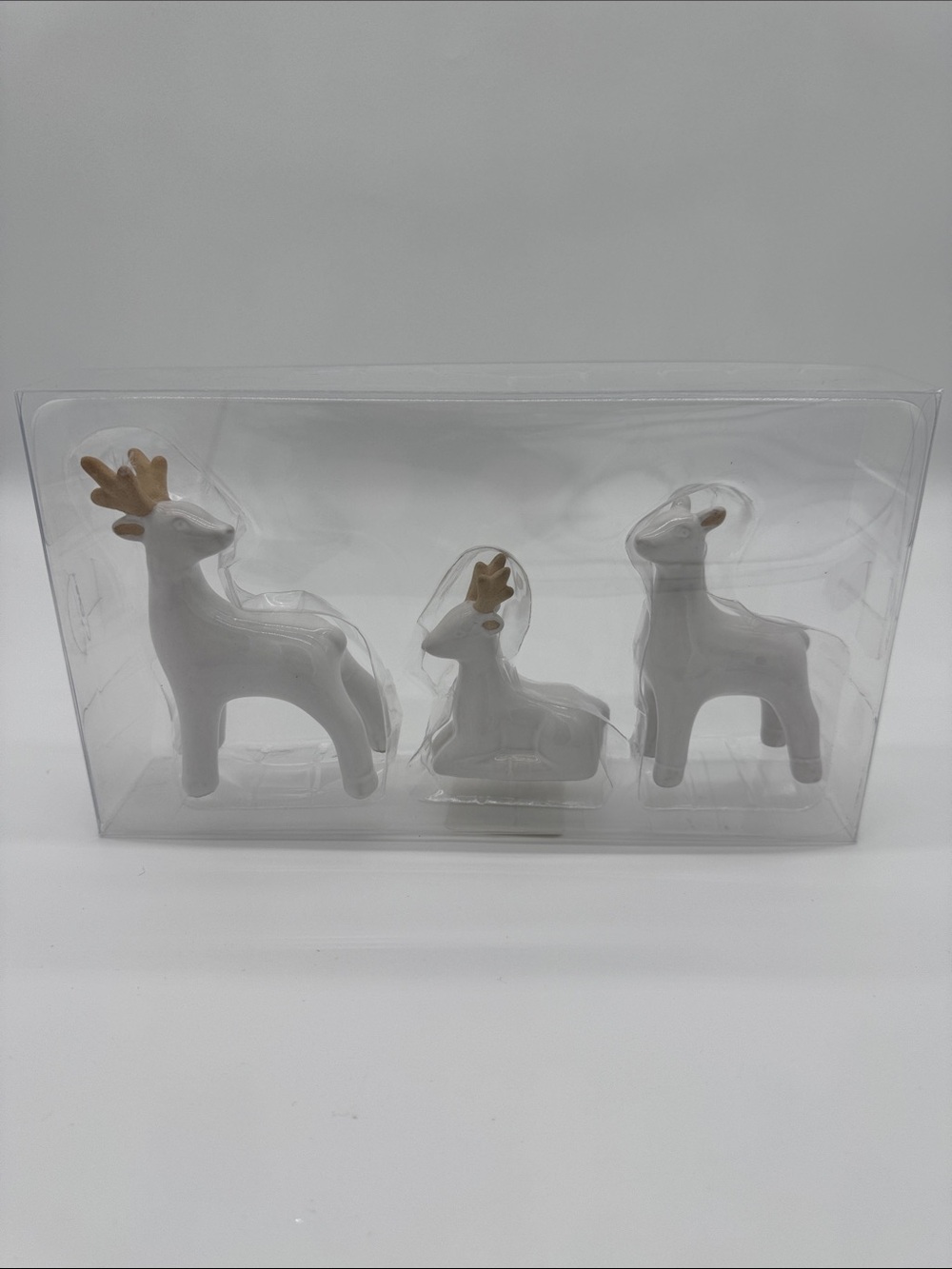 White Ceramic Reindeer Figurine Trio